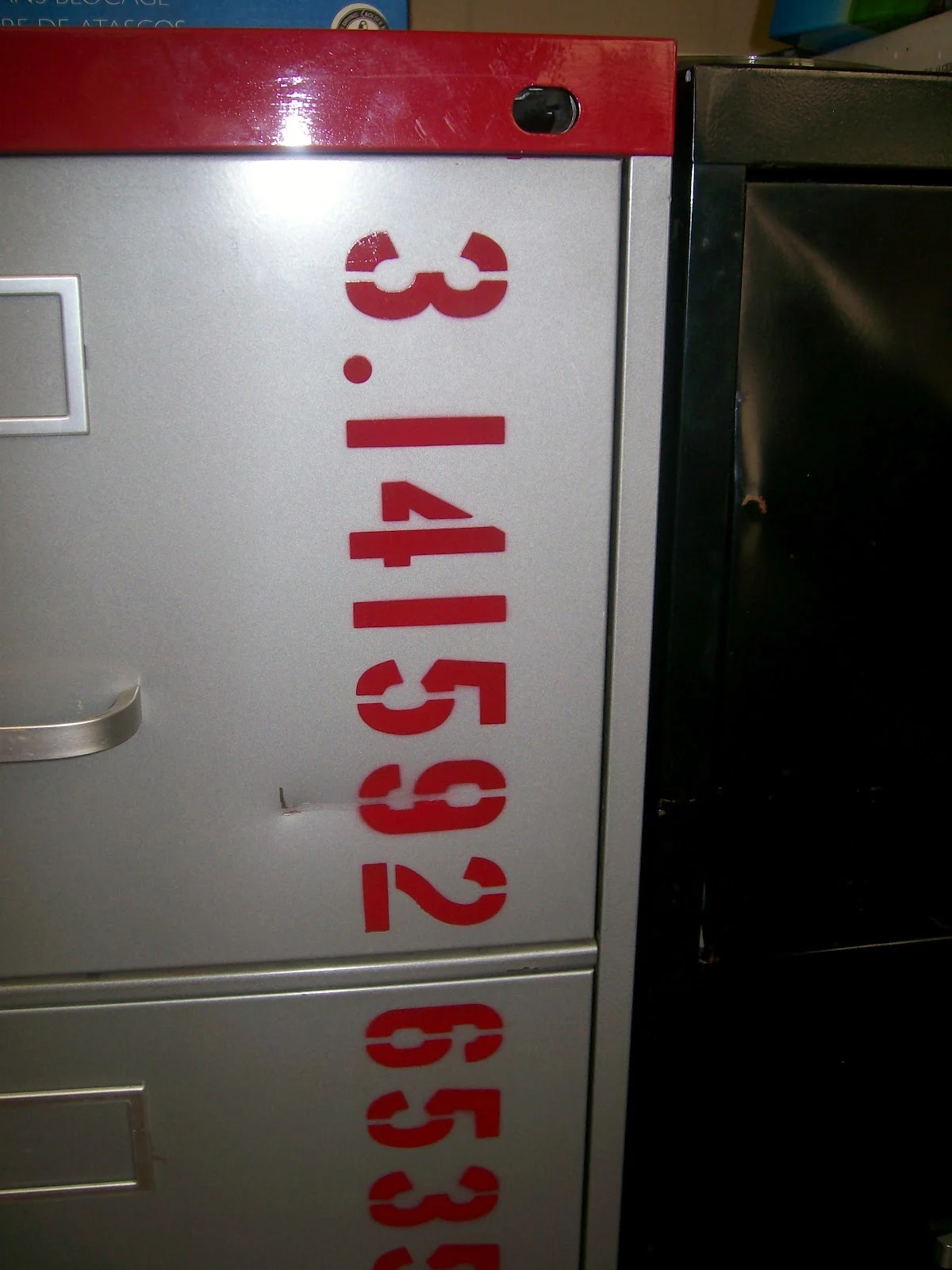 digits of pi painted on filing cabinet. 