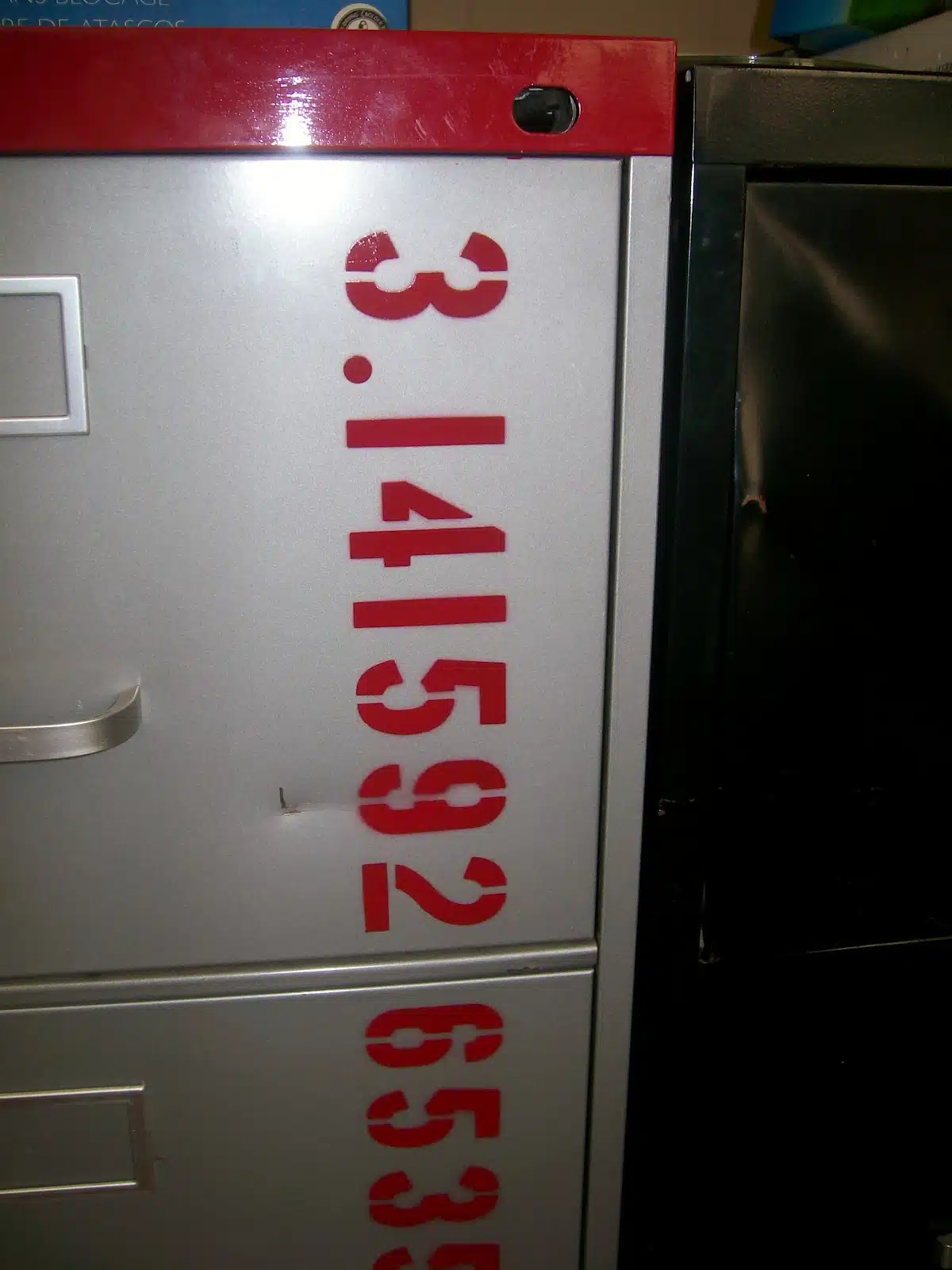 digits of pi painted on filing cabinet. 