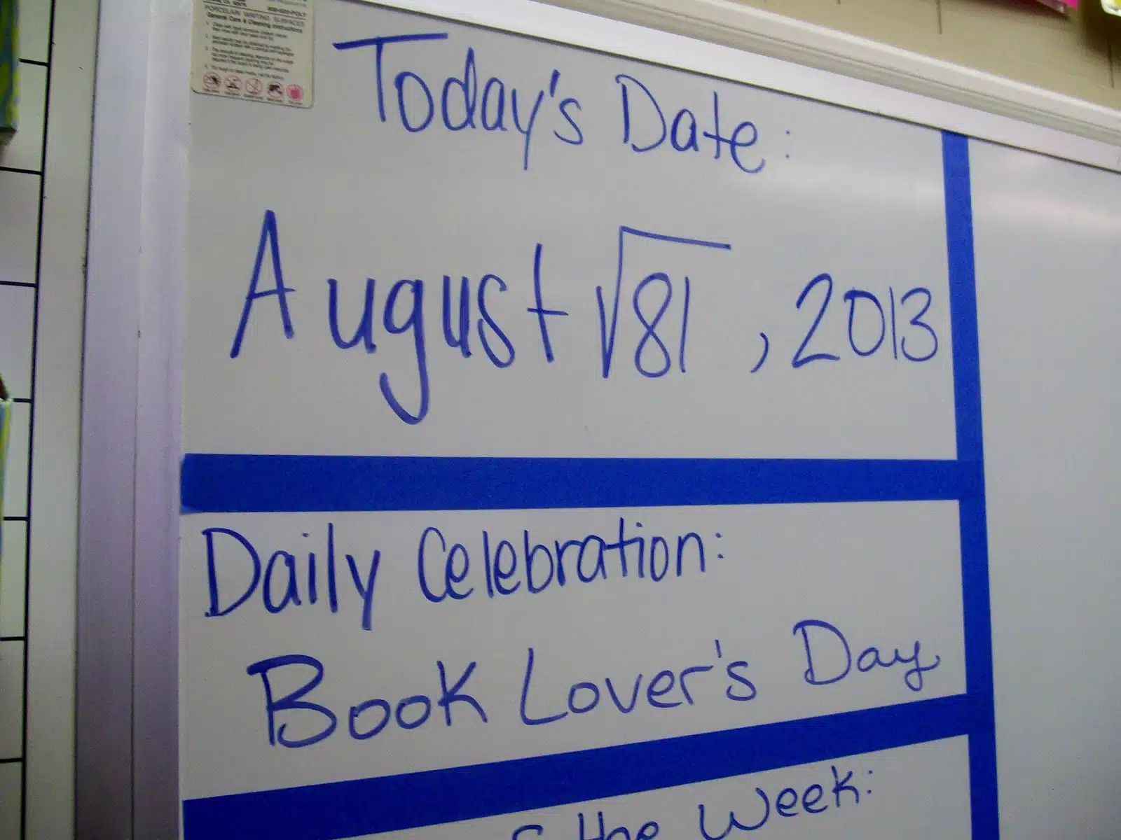 writing today's date as a math problem on dry erase board. 