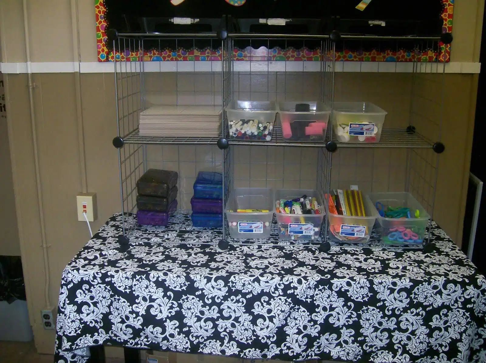 table with cube organizers in high school math classroom. 