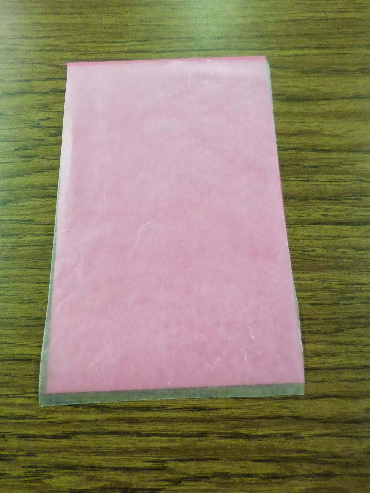 half sheet of paper covered with wax paper. 