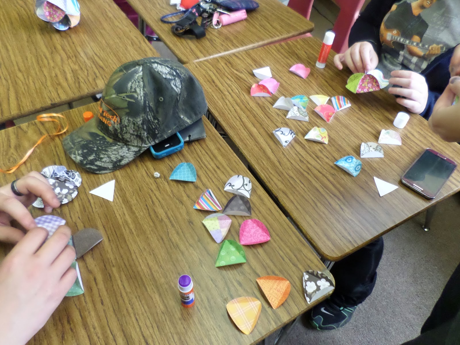 students building icosahedron ornament balls. 