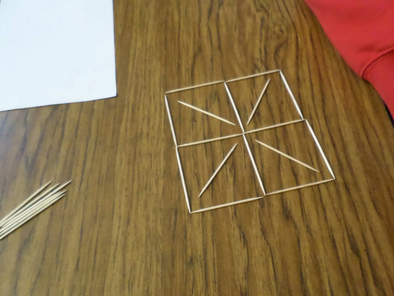 toothpick design on desk by student. 