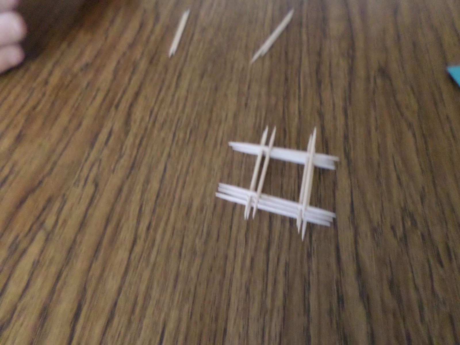 stacked toothpicks on student desk. 
