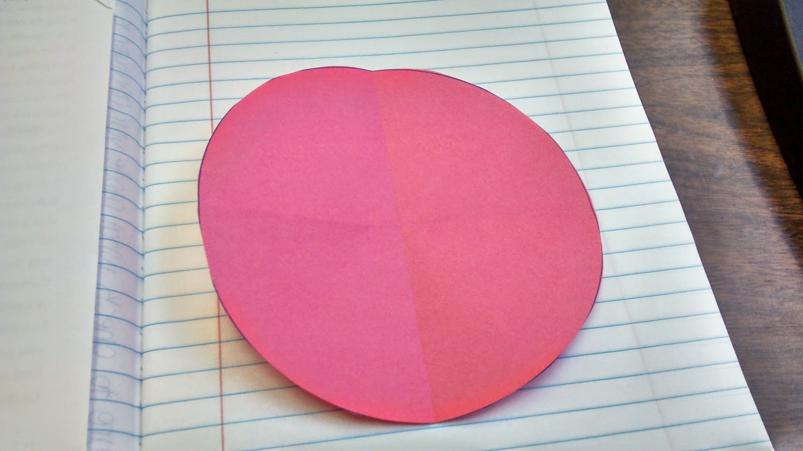paper circle folded in fourths. 