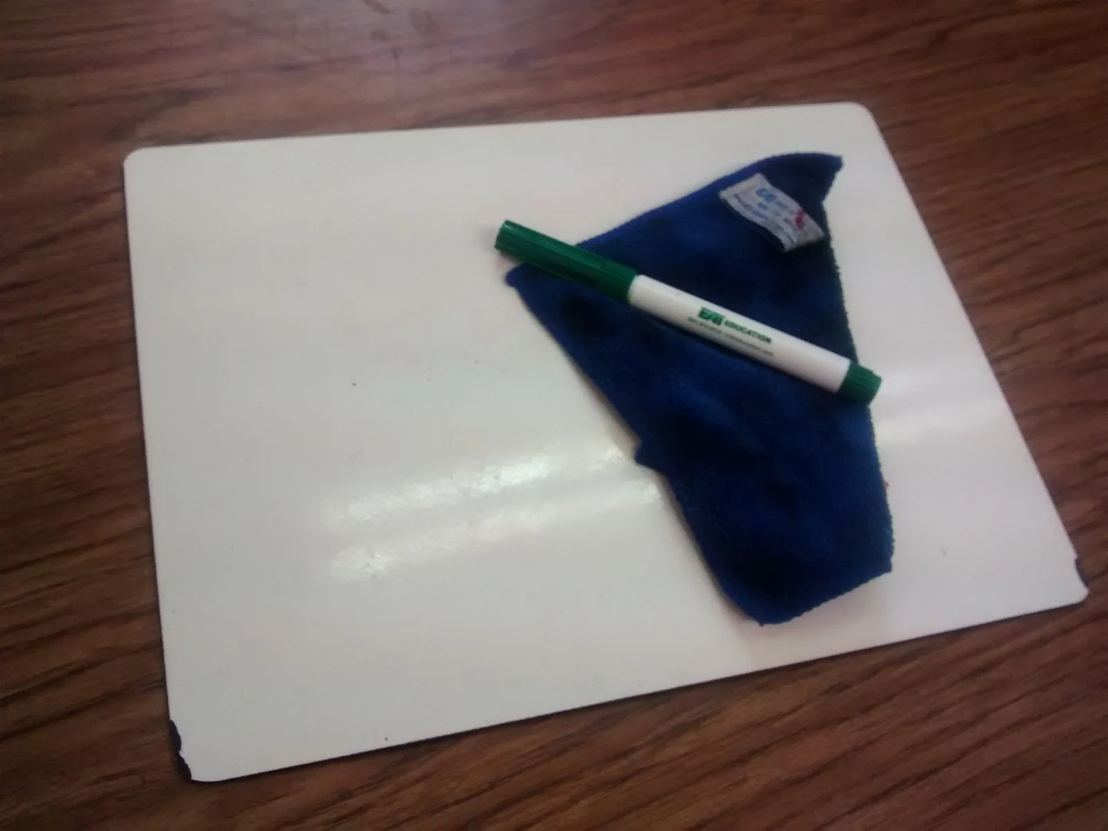 individual dry erase board, marker, and eraser cloth. 