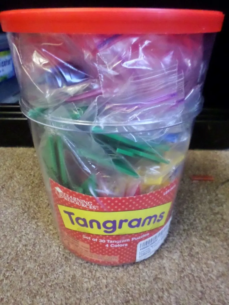 classroom set of plastic tangrams in bucket. 
