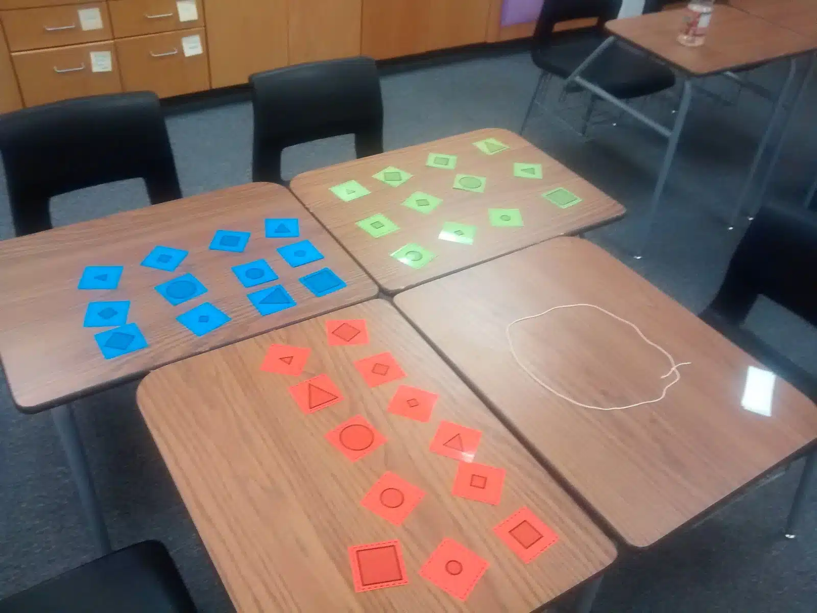 supplies laid out on tables for guess my rule activity. 