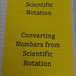 outside of scientific notation foldable. two flaps read "converting numbers to scientific notation" and "converting numbers from scientific notation."