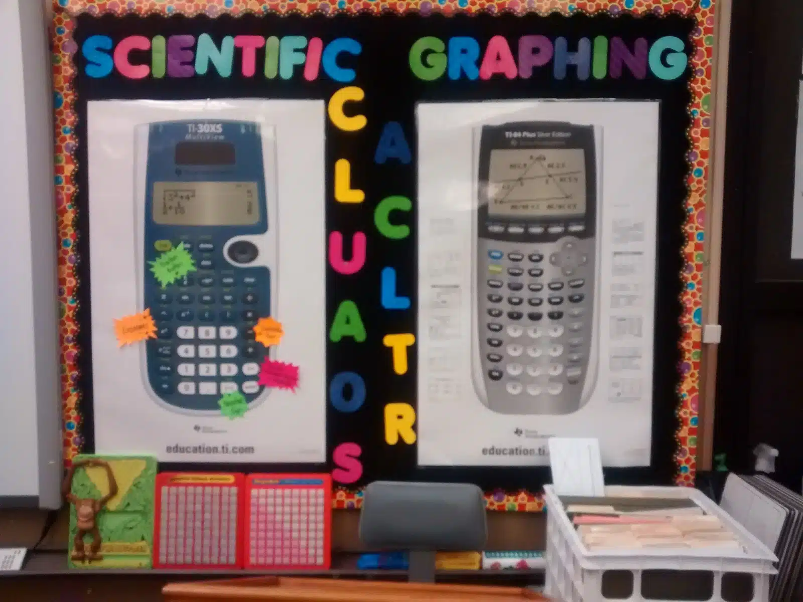 calculator bulletin board with posters of scientific calculator and graphing calculator