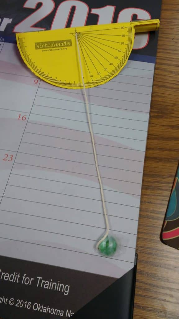 clinometer made out of yellow cardstock. 