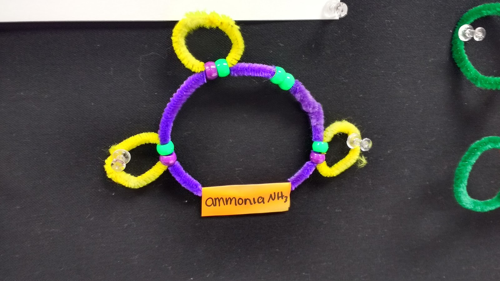 ammonia molecule made with pipe cleaners and pony beads. 