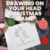 drawing of christmas tree on dry erase board with text 