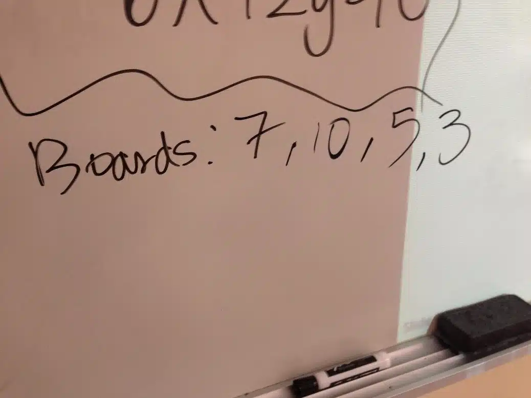 List of Sunken Treasure Powerpoint Game boards written on dry erase board. 