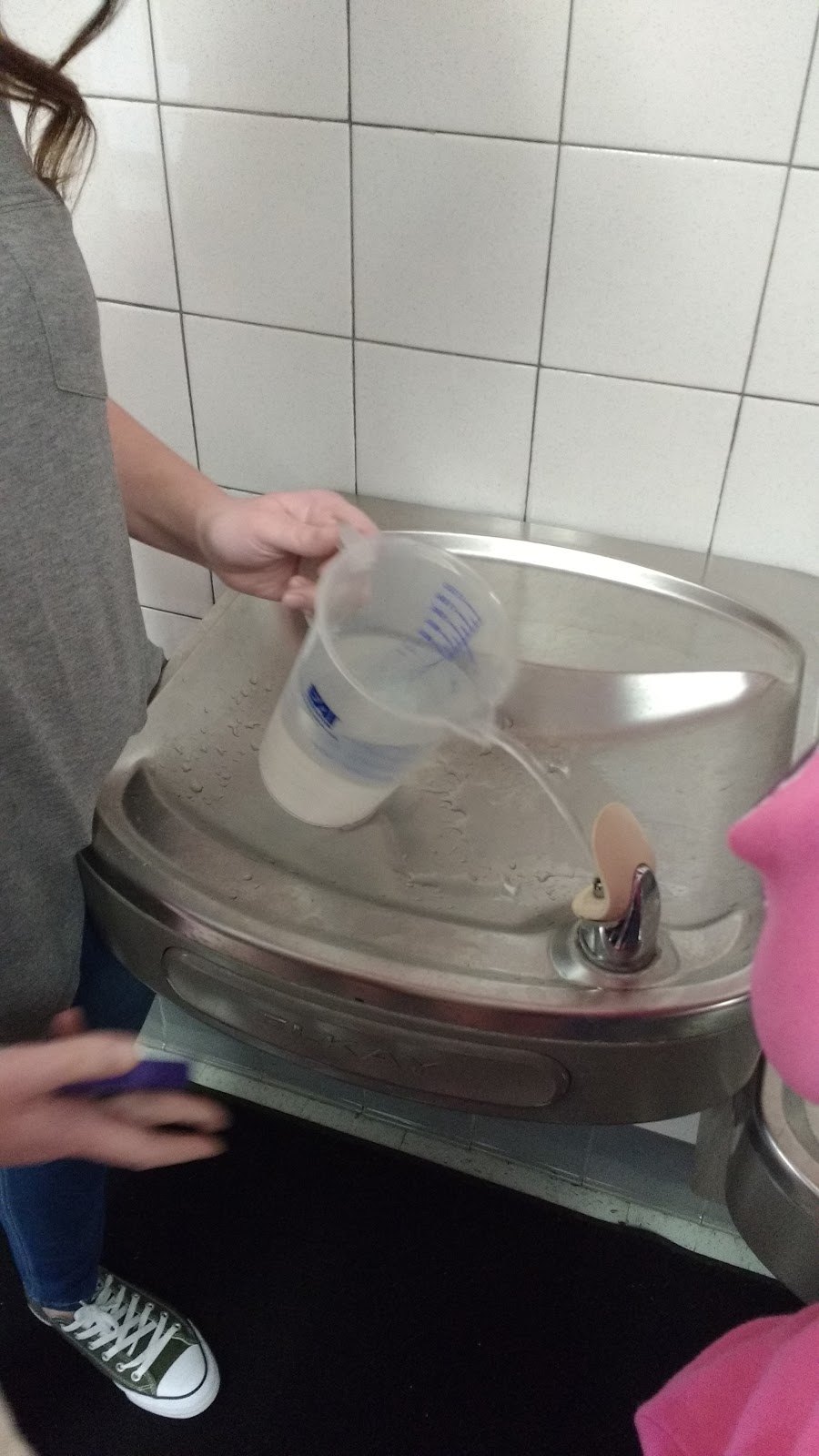 Filling Water Pitcher at Drinking Fountain