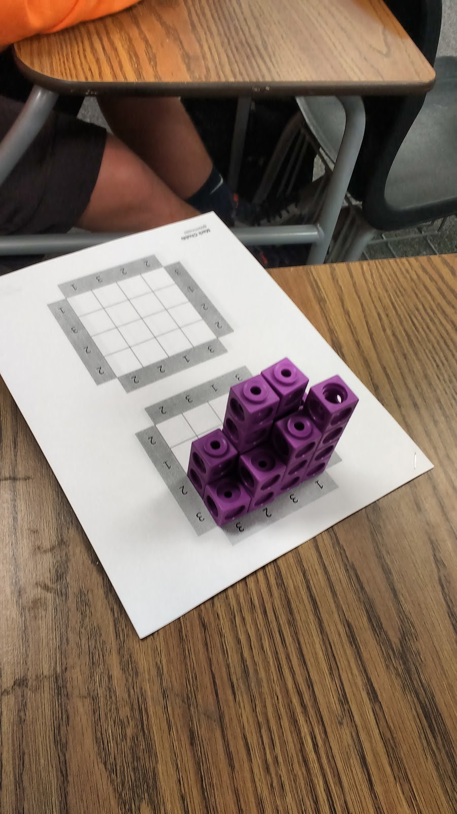 Students working on skyscraper puzzles. 