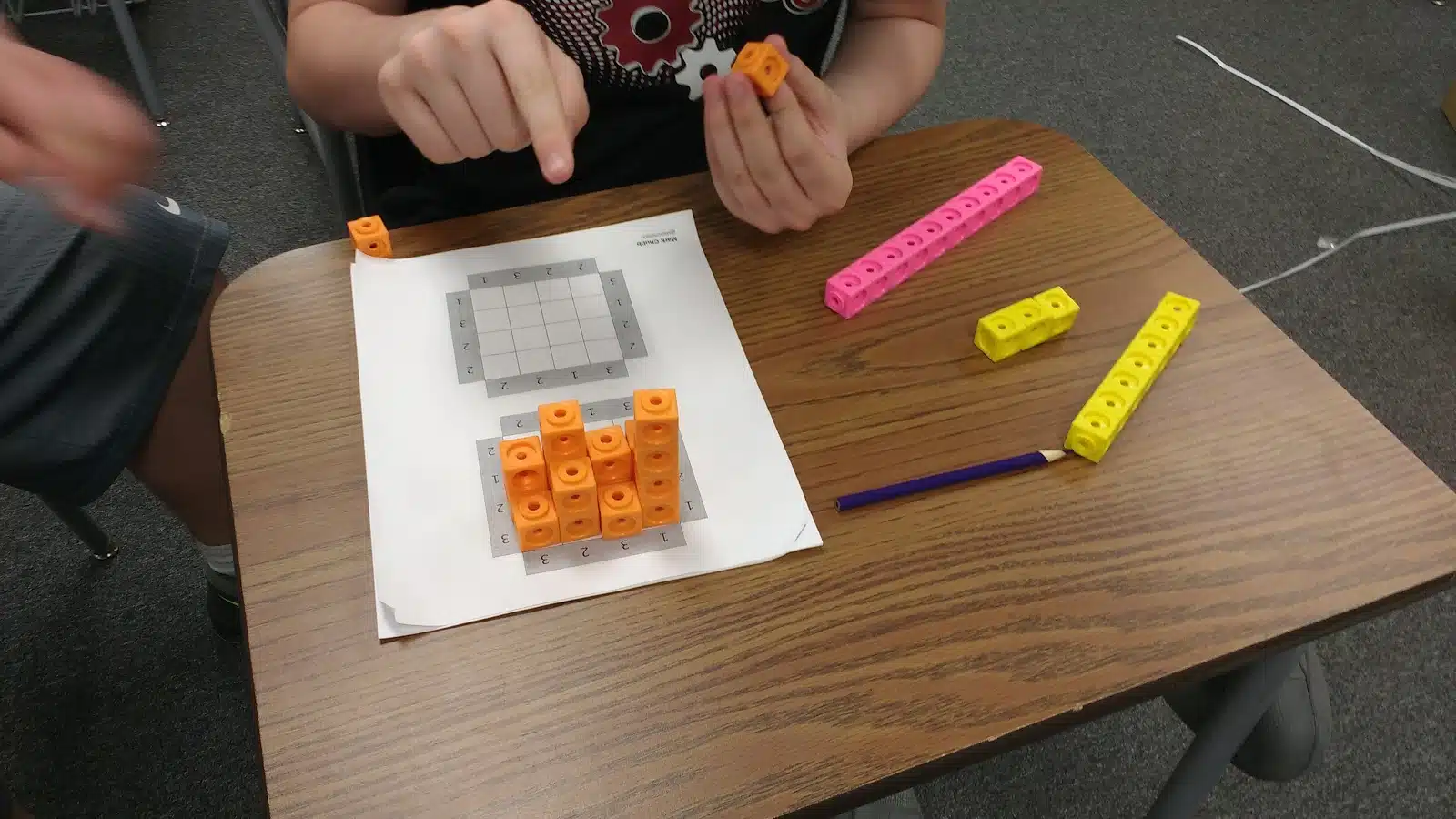 Students working on skyscraper puzzles. 