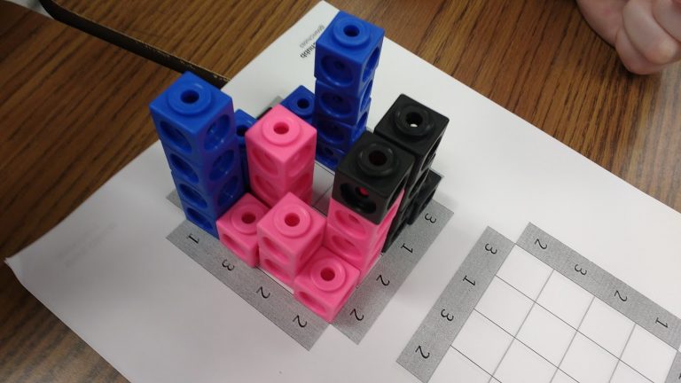 linking cubes on skyscraper puzzle board.