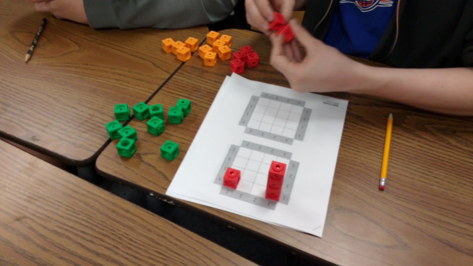 Students working on skyscraper puzzles. 