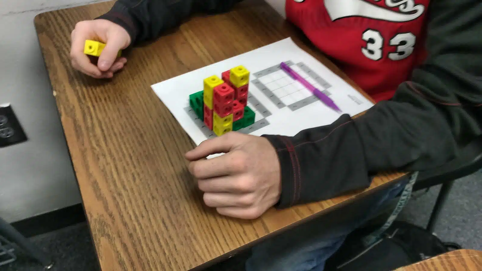 Students working on skyscraper puzzles. 