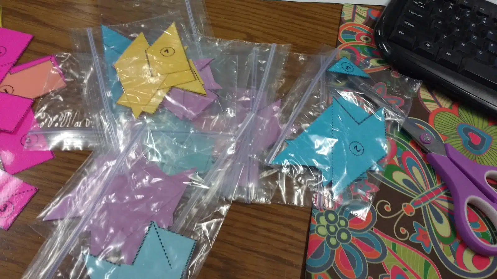 Square Pi Day Puzzle pieces in ziplock bags. 