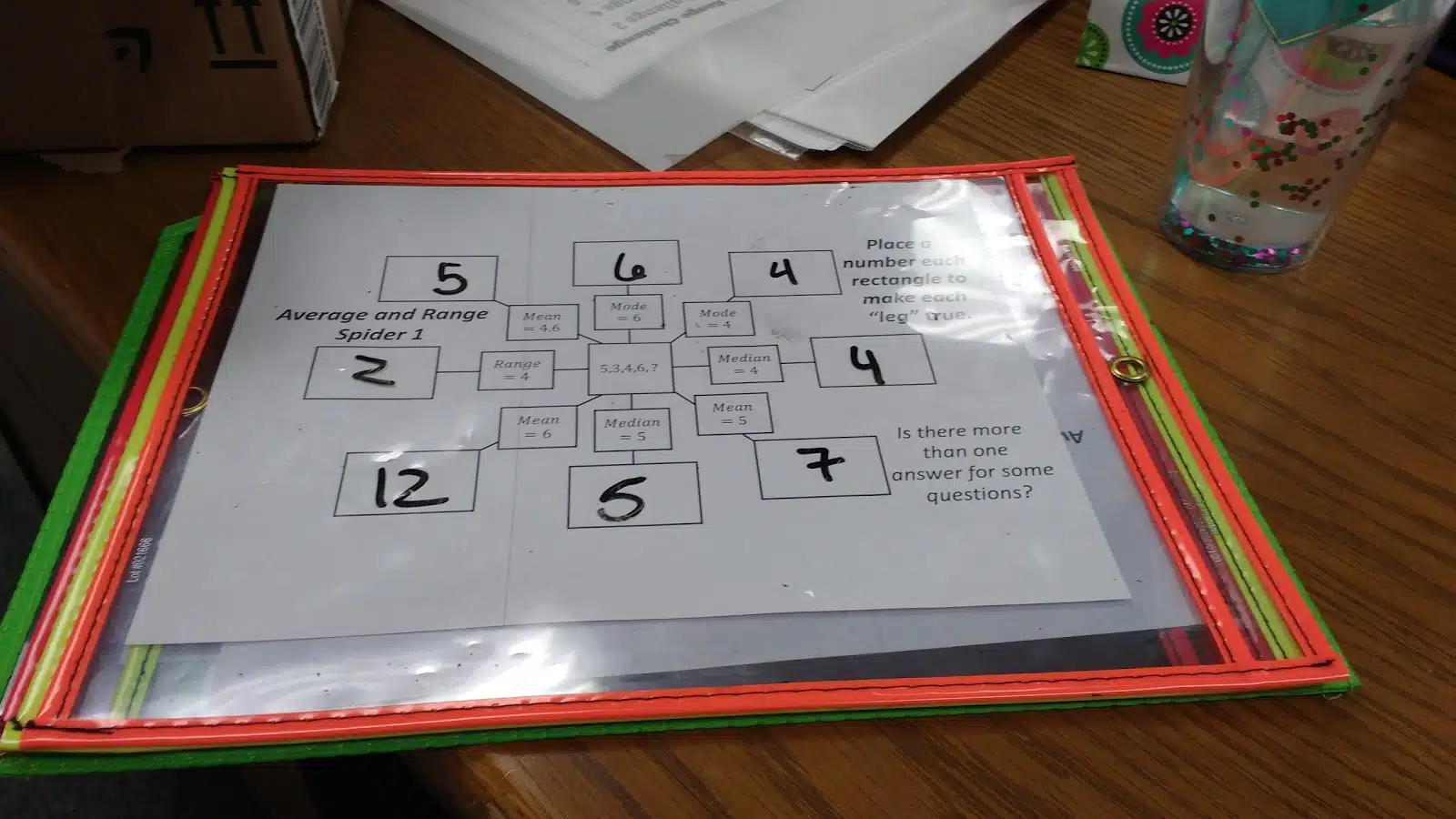 mean, median, mode, and range spider puzzles in dry erase pocket. 