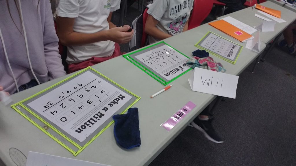 students playing make a million place value game