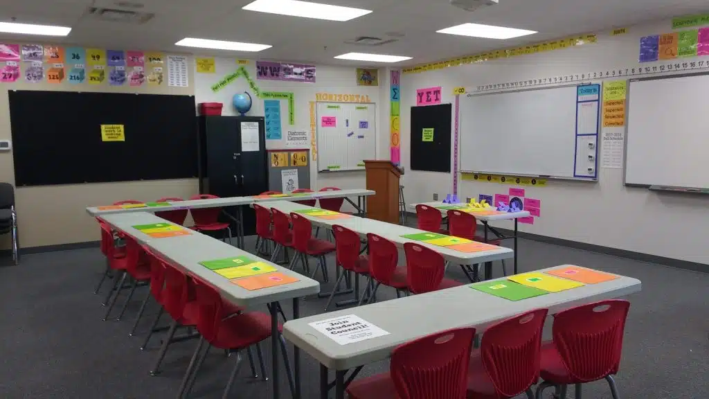 high school math classroom with "Student work is coming soon" poster on bulletin boards. 