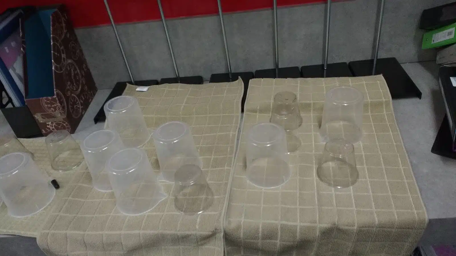 plastic beakers drying on drying mats. 