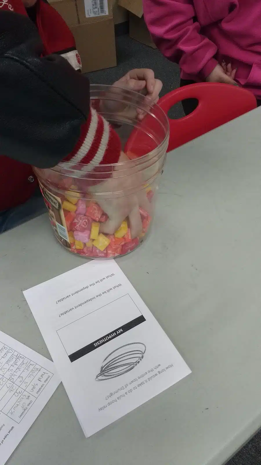 student grabbing starbursts for starburst scatterplot activity. 