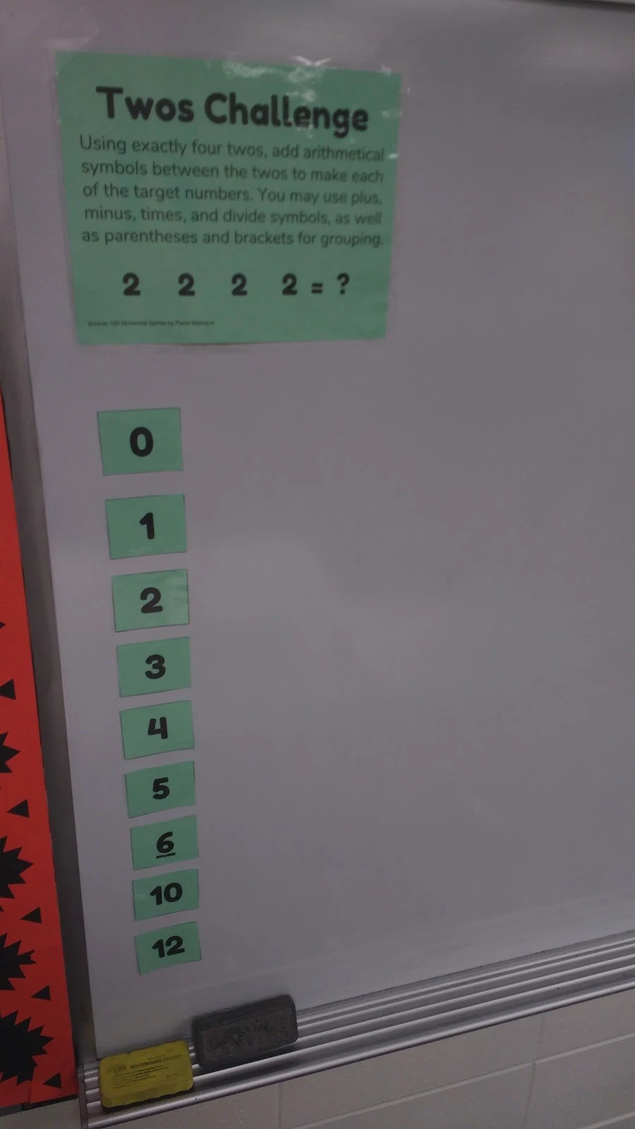 Twos Challenge Taped to Vertical Dry Erase Board 