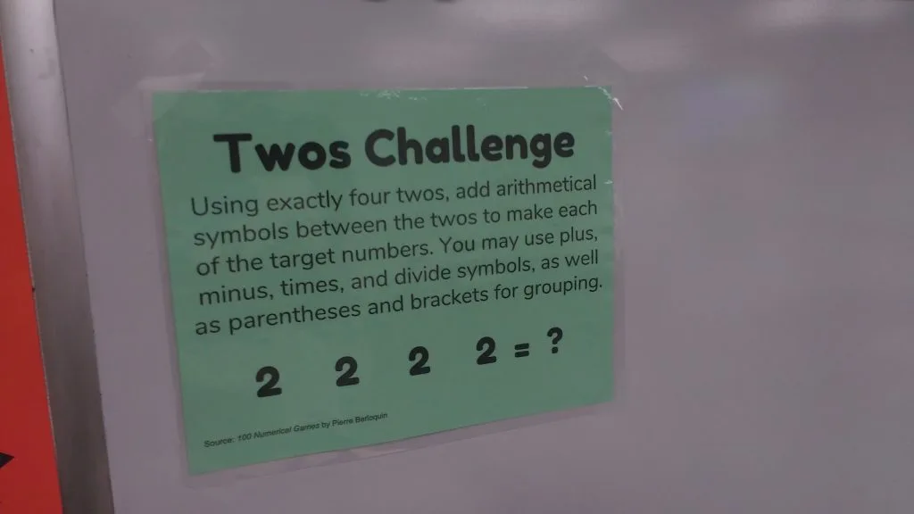 Twos Challenge Hanging on Dry Erase Board. 