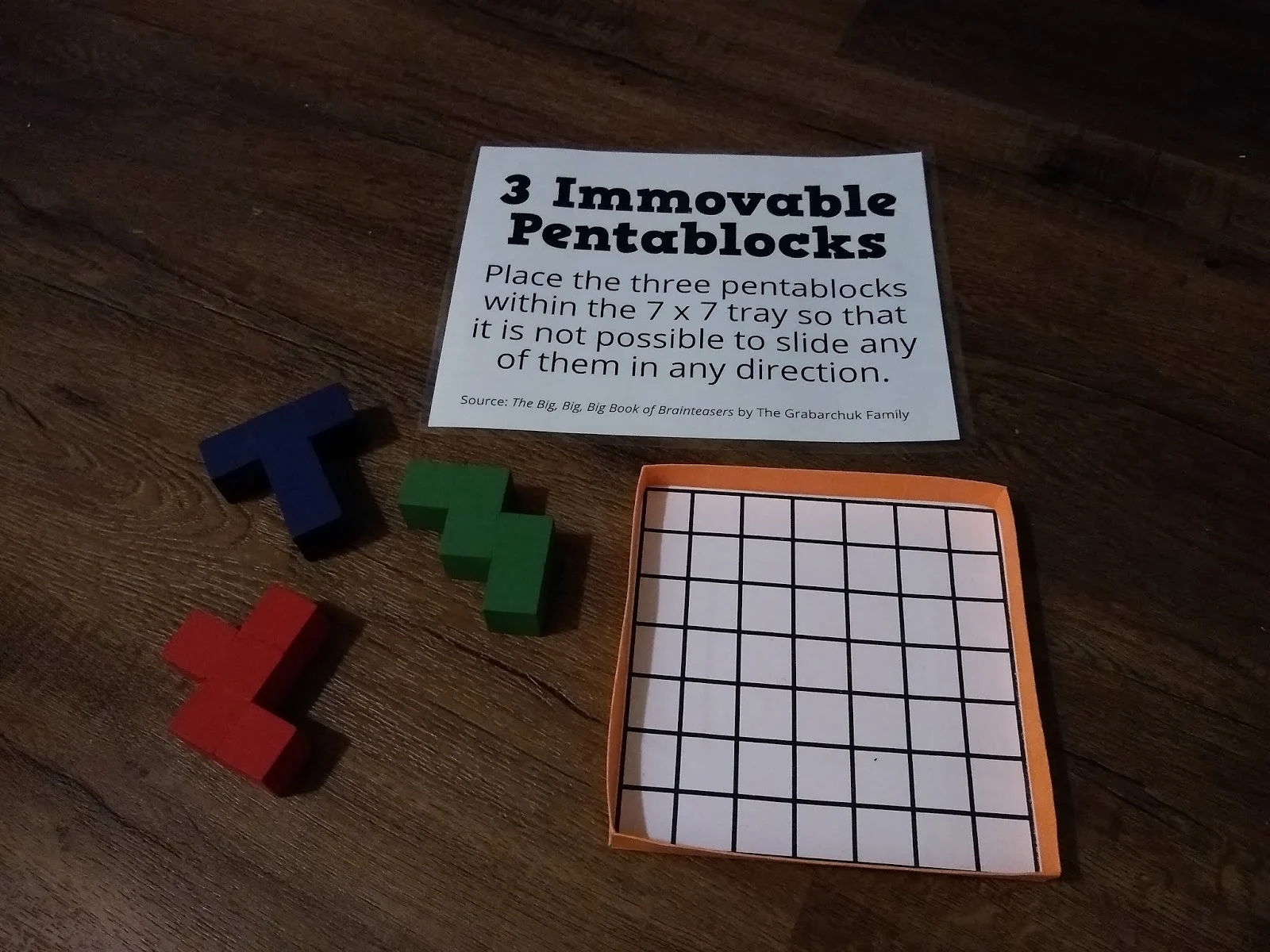 Three Immovable Pentablocks Puzzle