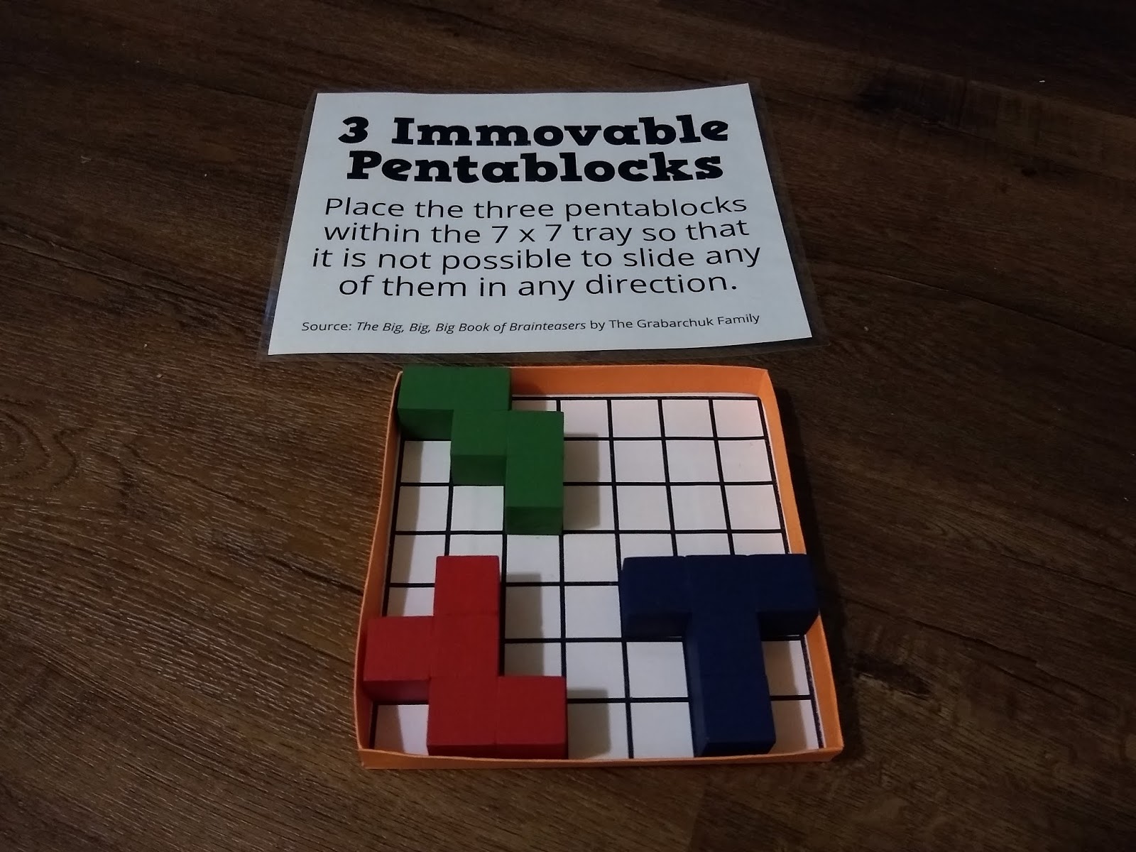Three Immovable Pentablocks Puzzle
