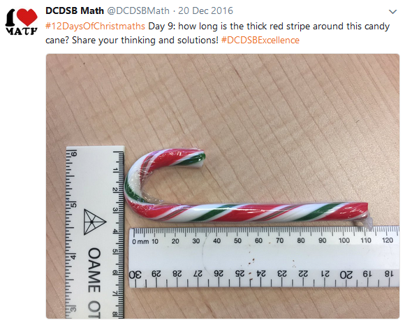 candy cane next to ruler 