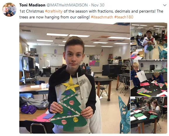 student holding paper christmas tree 