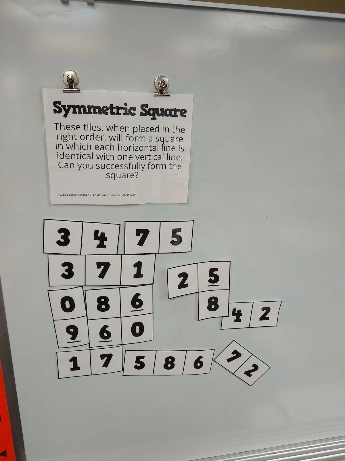 Symmetric Square Puzzle on Dry Erase Board. 