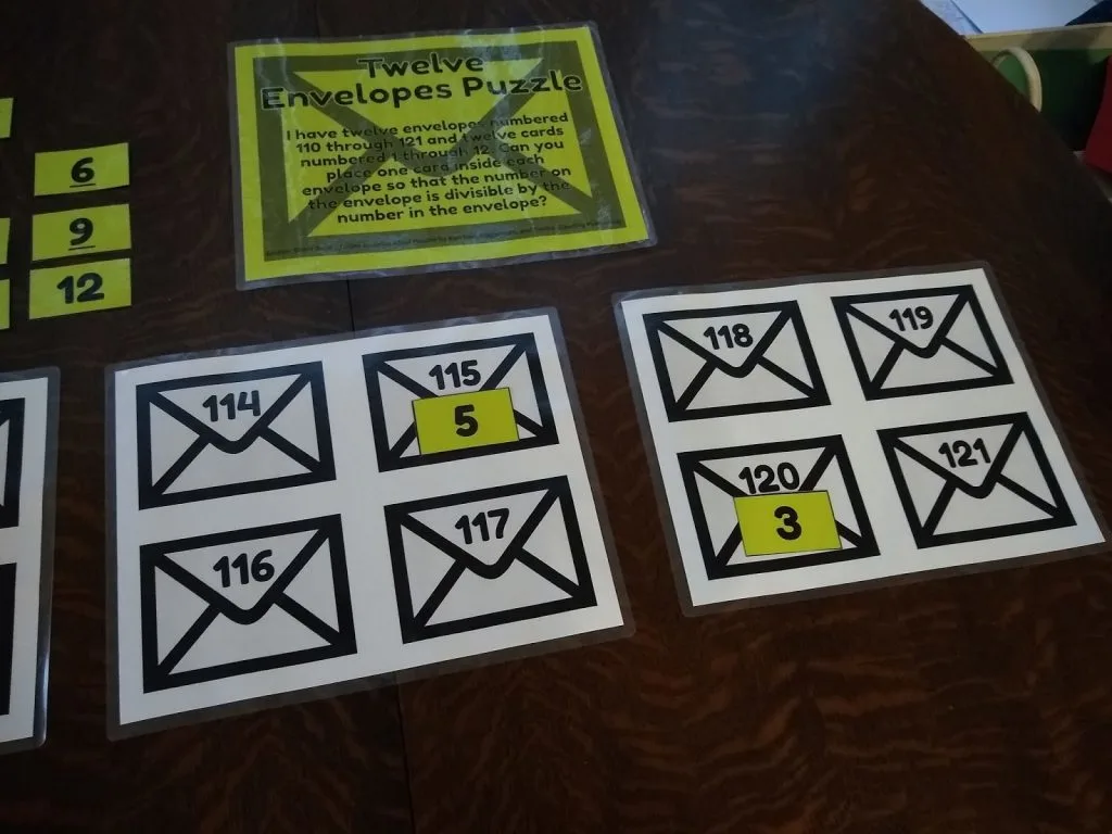 Twelve Envelopes Divisibility Rules Puzzle. 