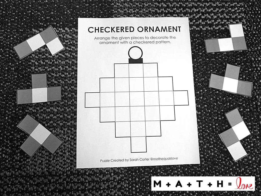 Checkered Ornament Puzzle with puzzle pieces laying on carpet. 