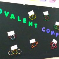 covalent compounds bulletin board with pipe cleaner models.