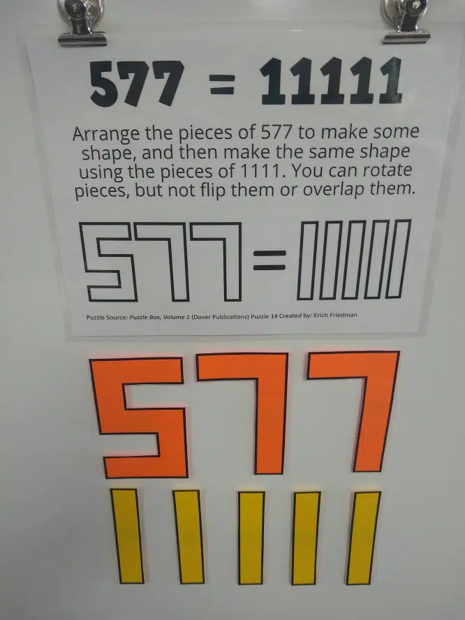 577=11111 Puzzle on Dry Erase Board.