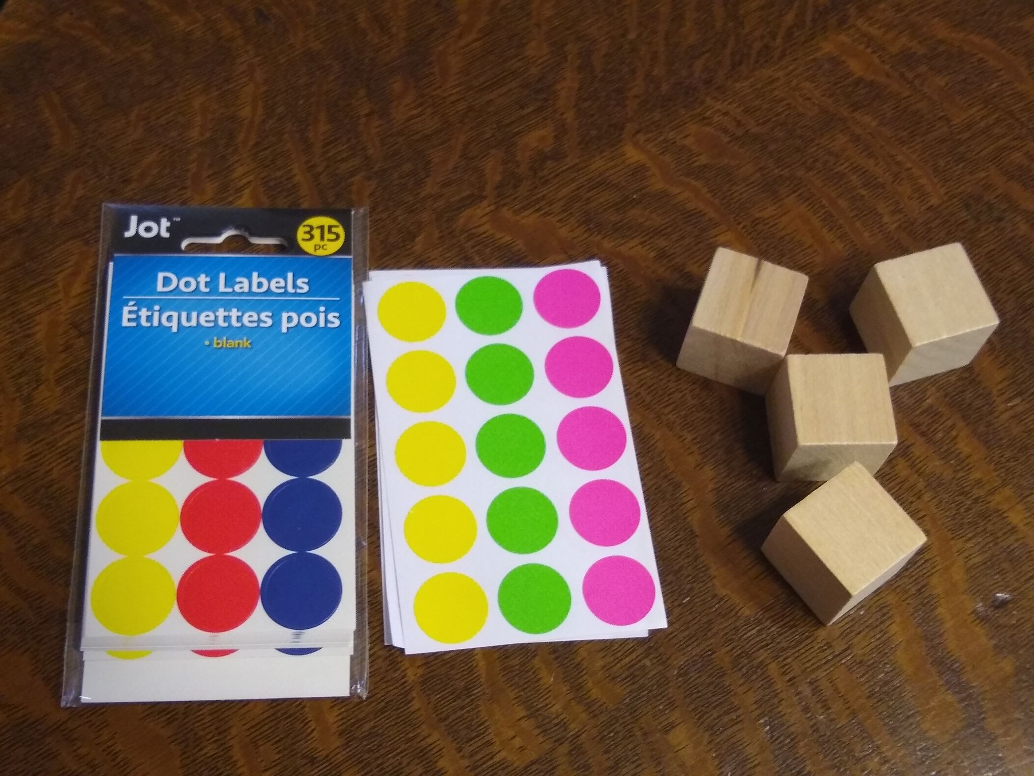 wooden cubes with dot stickers. 