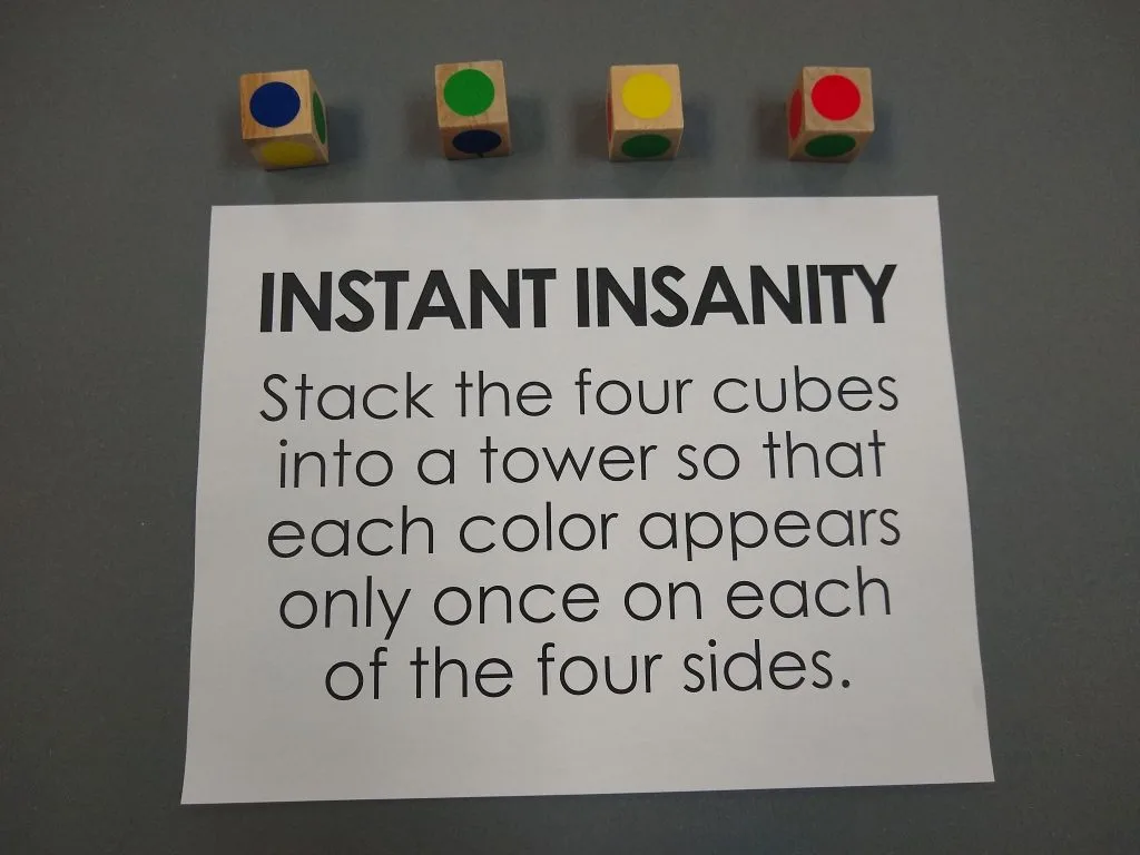 Instant Insanity Instructions with Cubes. 