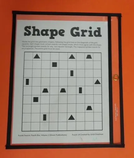 Shape grid puzzle in dry erase pocket.