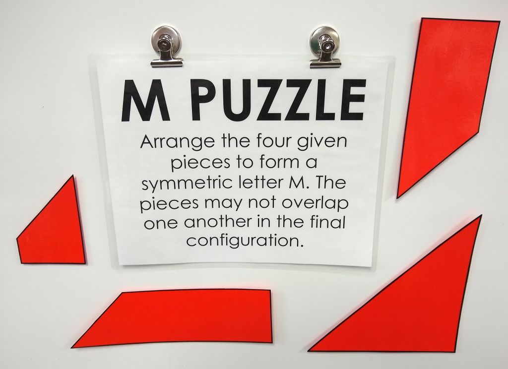 m puzzle four pieces letter m 