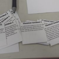 Printed cards with stories about chemical accidents.