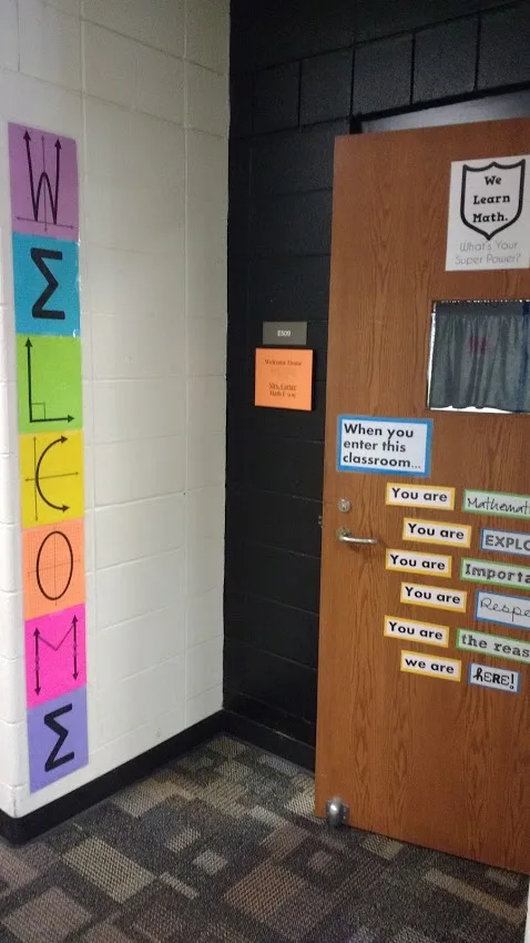 math welcome poster outside door of high school math classroom. 