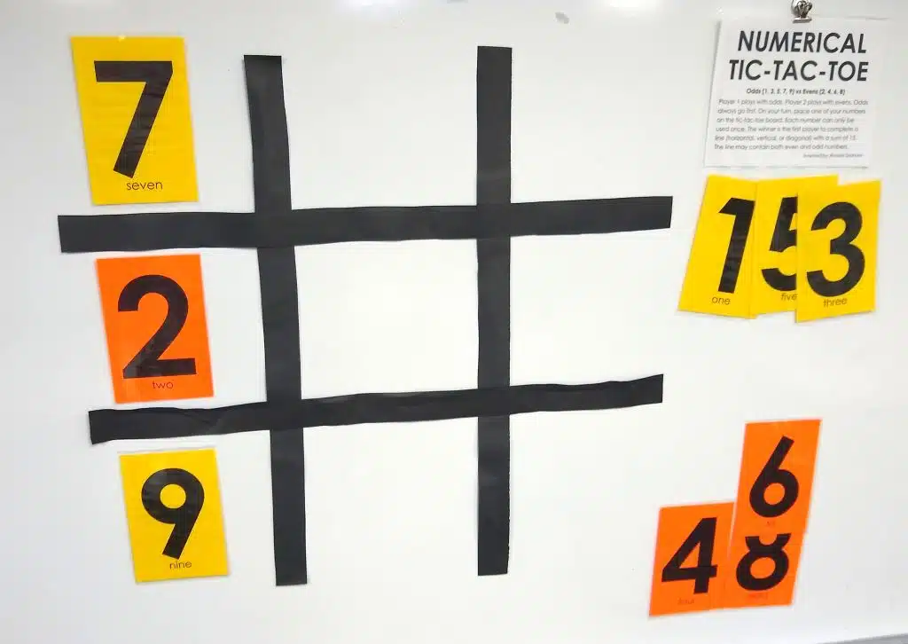 tic tac toe board with 7, 2, and 9 in left column of numerical tic tac toe board. 