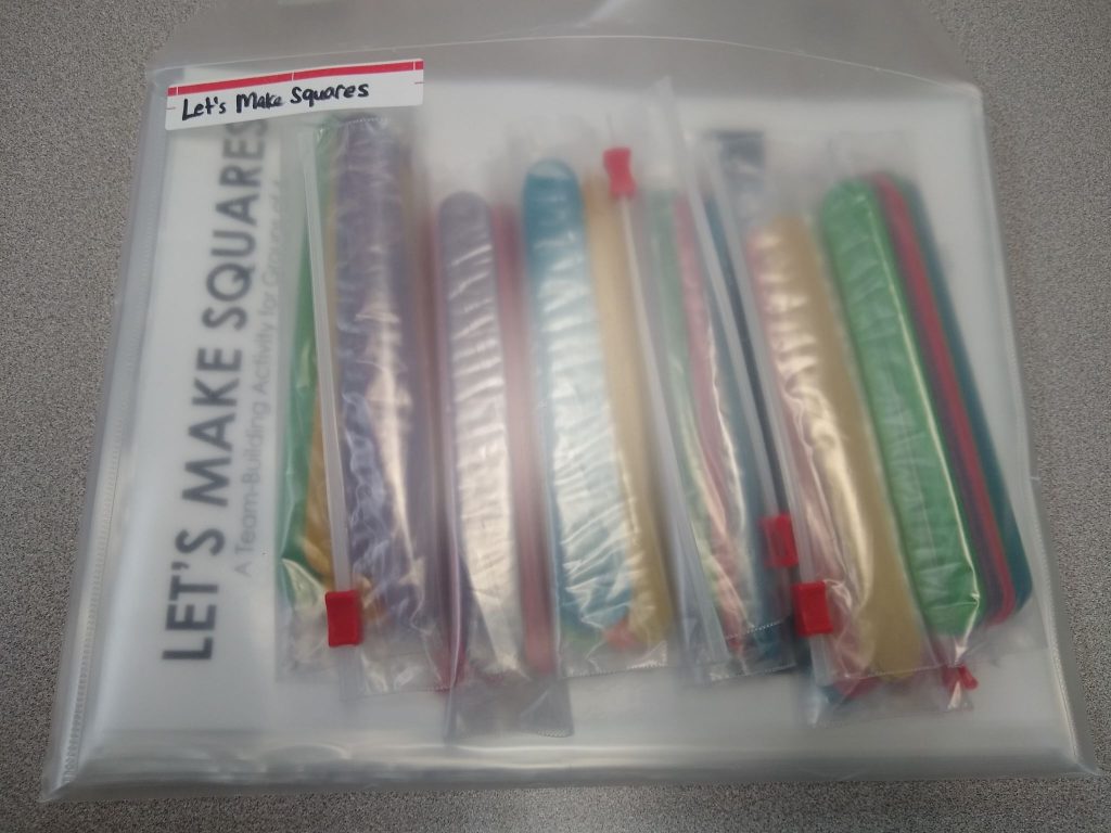 Popsicle sticks bagged up for let's make squares activity. 