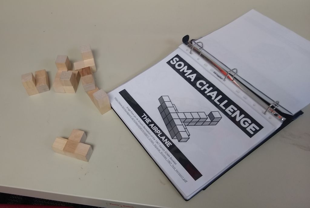 soma challenge binder with soma blocks. 
